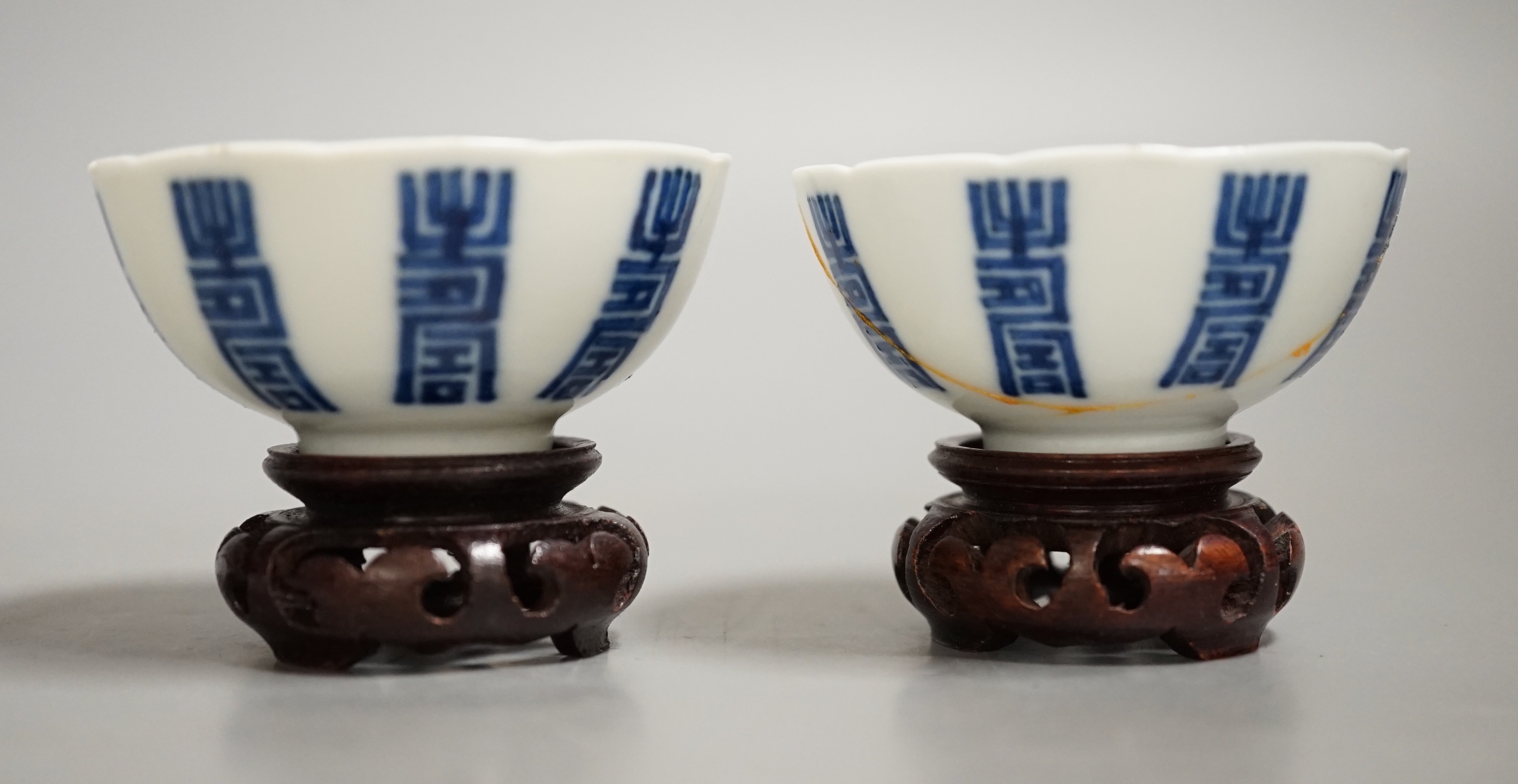 A pair of Chinese blue and white 'shou' cups, 19th century.